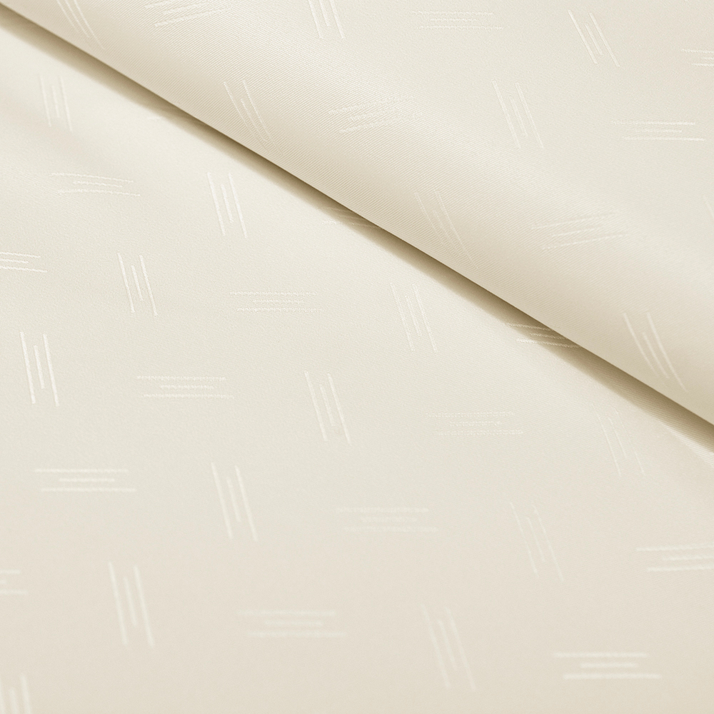 Obrusowa tkanina typu żakardowego w kolorze ecru.