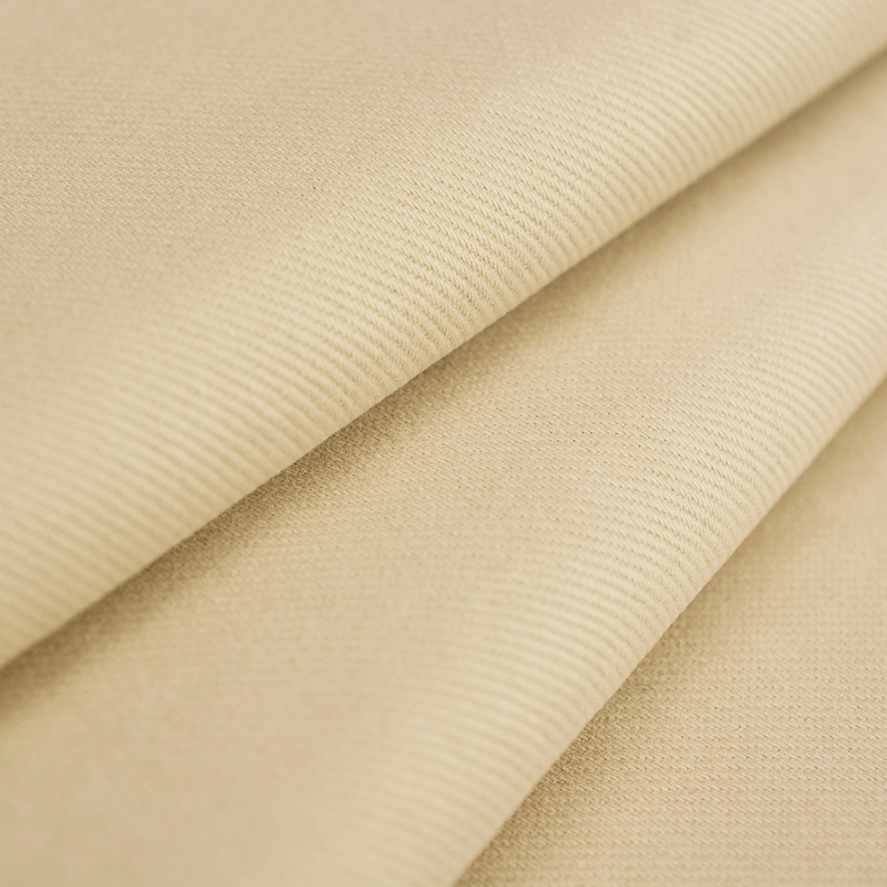 Jeansowa tkanina bawełniana wyróżnia się diagonalną fakturą i jednolitym kolorem.