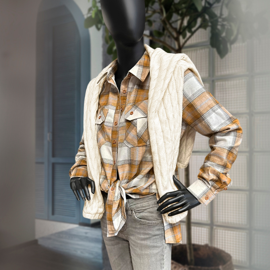 Miękka flanela wykonana z połączenia włókien bawełnianych i syntetycznych, w modnym wzorze kraty.