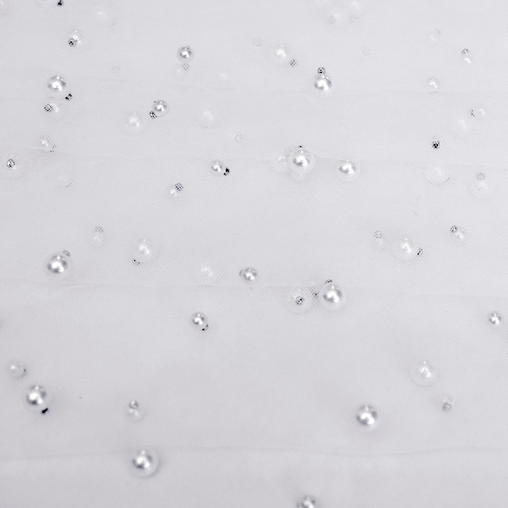 Tiul perełka, delikatna tkanina w formie siateczki.