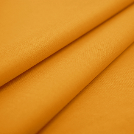 Tkanina bawełniana o splocie płóciennym, wyprodukowana w Polsce.